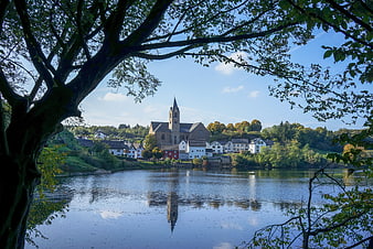 Ulmener Maar Lake Reflection of Eifel Village and Church in Autumn