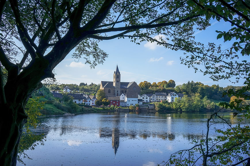 Ulmener Maar Lake Reflection of Eifel Village and Church in Autumn