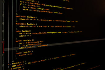 Close-up of JavaScript code on a dark computer screen