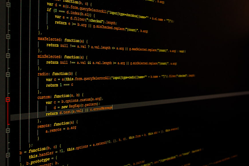 Close-up of JavaScript code on a dark computer screen
