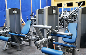 Blue and silver gym machines in fitness center