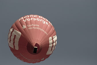 Red Hot Air Balloon with Sparkasse Branding Against Blue Sky