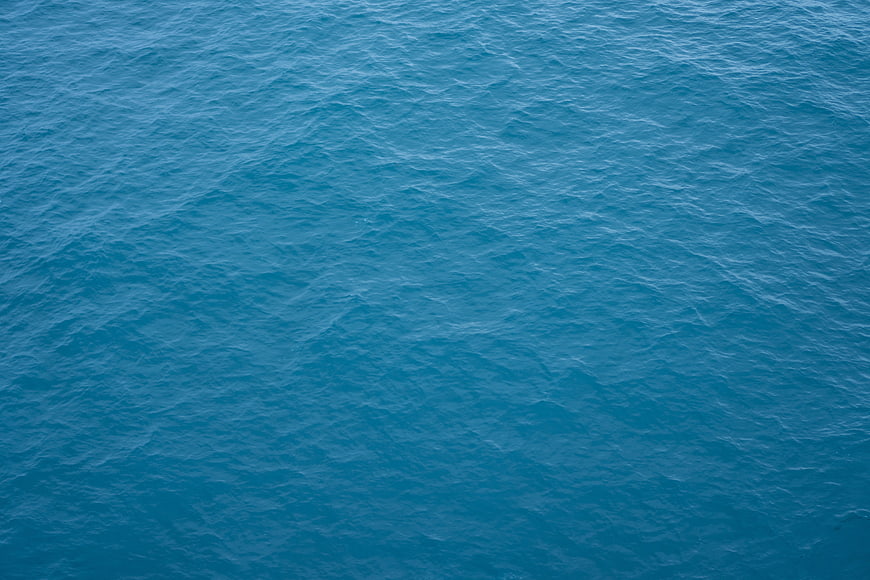 Aerial View of Blue Ocean Water Surface Texture