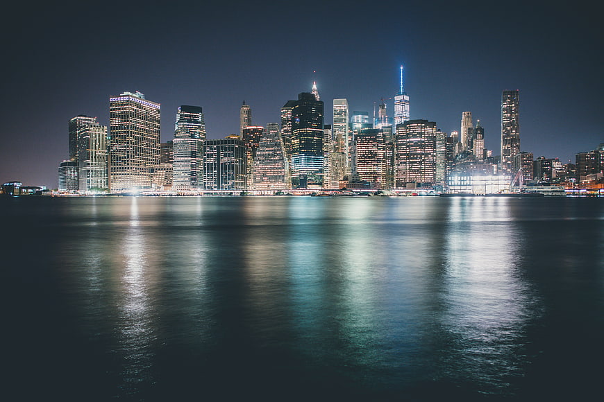 New York City Skyline at Night with Water Reflections