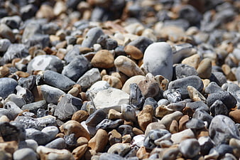 Close-up of smooth pebbles on a rocky beach