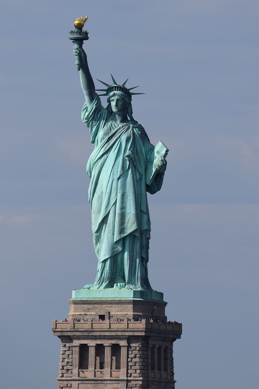 Statue of Liberty Full Body View Against Clear Blue Sky