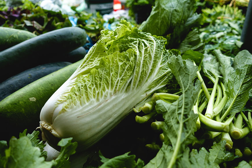 Fresh Napa Cabbage and Vegetables at Market