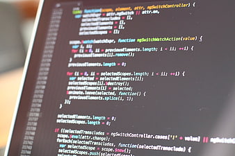 Close-up of JavaScript Code on Dark Monitor Screen