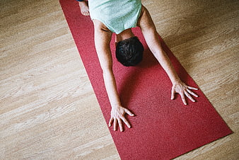Top View of Woman Doing Downward Dog Yoga Pose