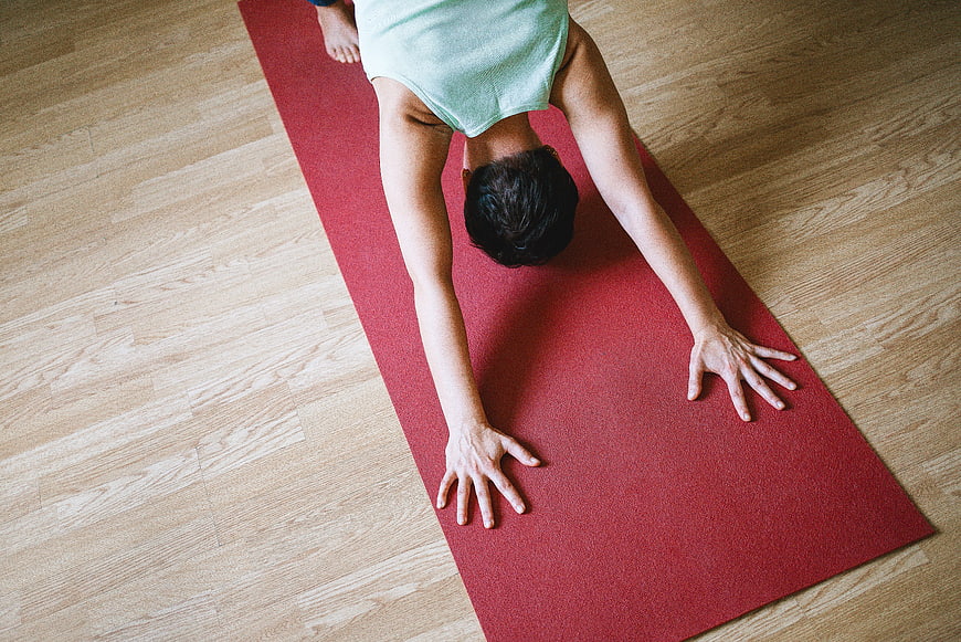 Top View of Woman Doing Downward Dog Yoga Pose