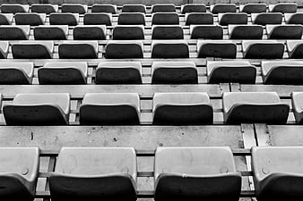 Rows of empty black and white stadium seats