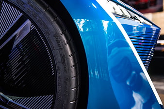 Close-up of Blue Sports Car Wheel and Fender