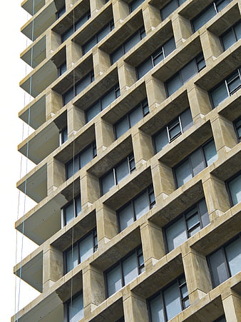 Low angle view of modern concrete apartment building facade
