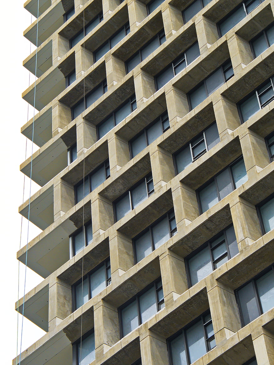 Low angle view of modern concrete apartment building facade