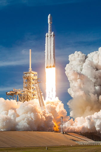 Space Shuttle Launching into Blue Sky with Smoke