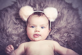 Cute Baby Girl Wearing Fluffy Bear Ear Headband On Fur