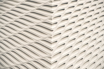 White geometric architectural facade with repeating pattern