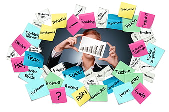 Businesswoman holding bar chart surrounded by colorful business strategy sticky notes