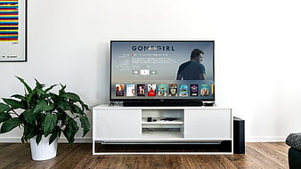 Modern Living Room With Smart TV And White Media Console