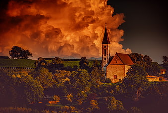 Dramatic Sunset Over Rural Church Tower And Vineyards