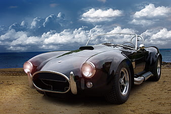 Classic Black Cobra Convertible on Sandy Beach