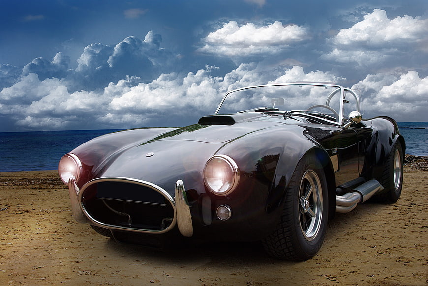 Classic Black Cobra Convertible on Sandy Beach