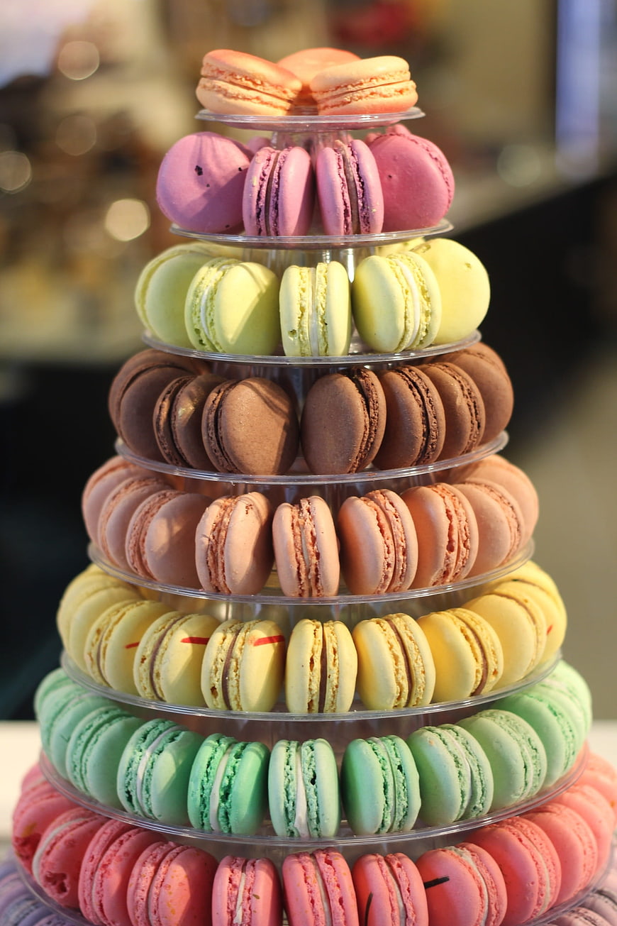 Colorful Macarons Displayed on a Multi-Tiered Clear Acrylic Stand