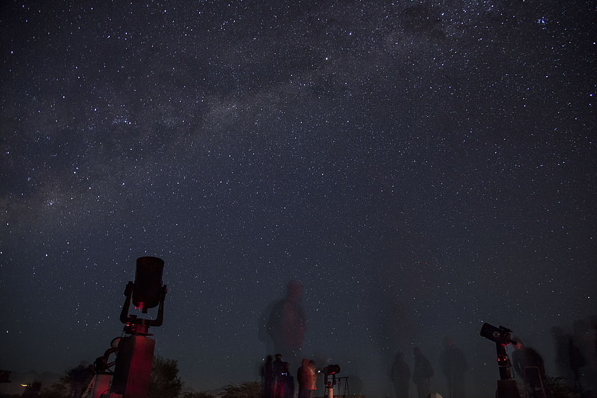 Stargazing with telescopes under the Milky Way night sky