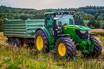 Green John Deere Tractor with Trailer in Field