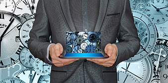Businessman holding tablet with clock collage background