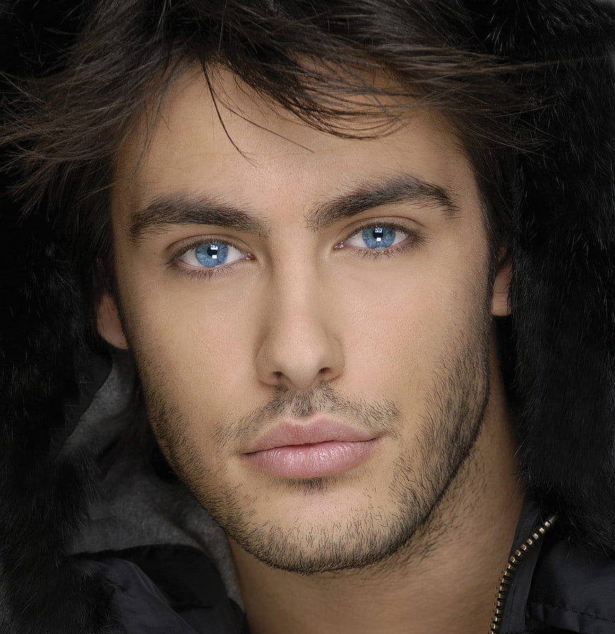 Close-up portrait of handsome man with blue eyes and beard
