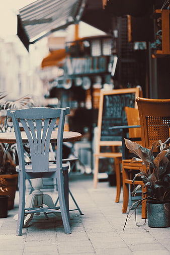 Empty Blue Wooden Chair at Outdoor Cafe Terrace