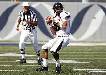 American Football Quarterback Throwing Ball on Field
