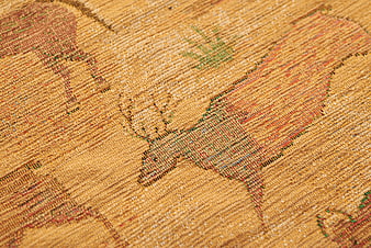 Close-up of vintage western fabric with horse pattern