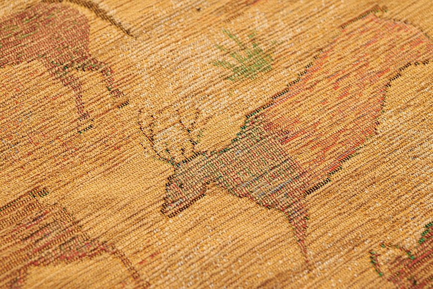 Close-up of vintage western fabric with horse pattern
