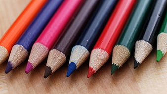 Close-up of colorful pencils on wooden surface