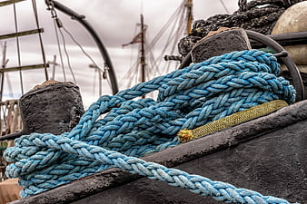 Coiled Blue Rope on Historic Ship Deck