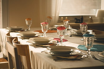 Set dining table with cocktail umbrellas and natural light
