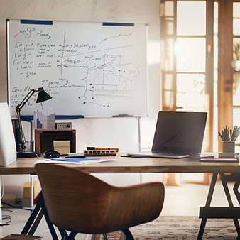 Modern Home Office Desk with Whiteboard and Laptop