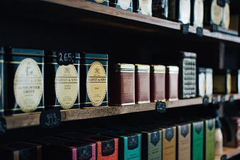 Vintage Harney & Sons Tea Tins on Wooden Shelves