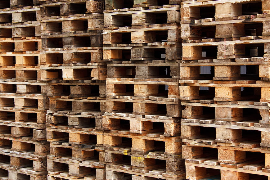 Stacked Wooden Pallets Industrial Warehouse Background