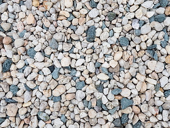 Close-up texture of mixed white and gray river stones