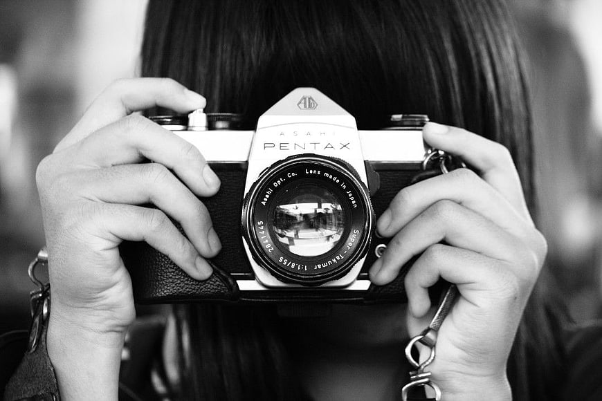 Woman Holding Vintage Pentax Film Camera