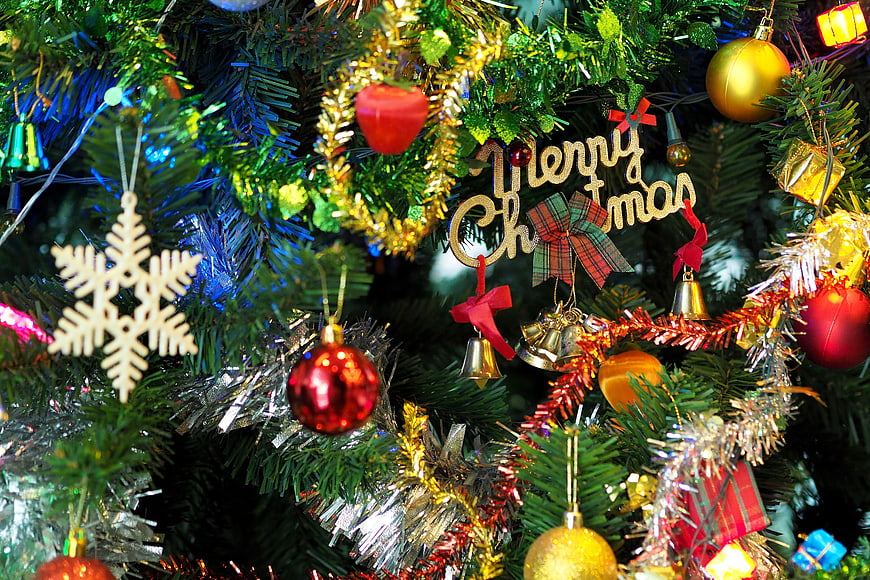 Close-up of decorated Christmas tree with ornaments and lights