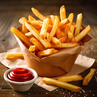 Crispy French Fries in Paper Cone with Ketchup