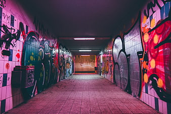 Colorful graffiti tunnel with vibrant street art and neon lighting