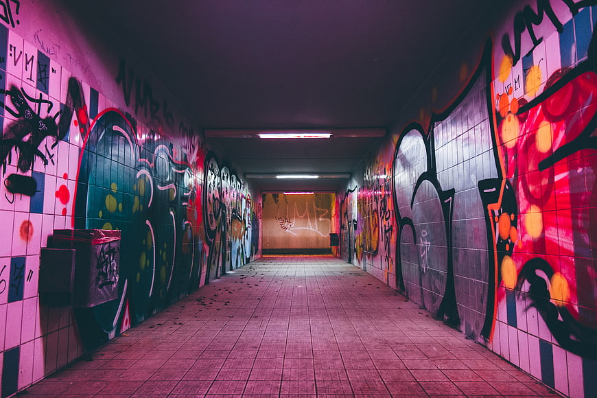 Colorful graffiti tunnel with vibrant street art and neon lighting