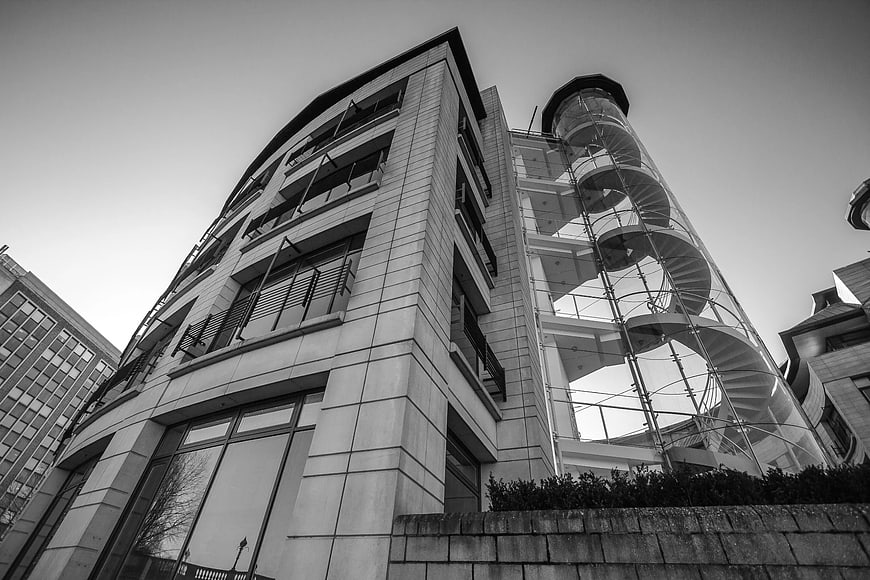 Low Angle Black and White Modern Architecture with Spiral Staircase
