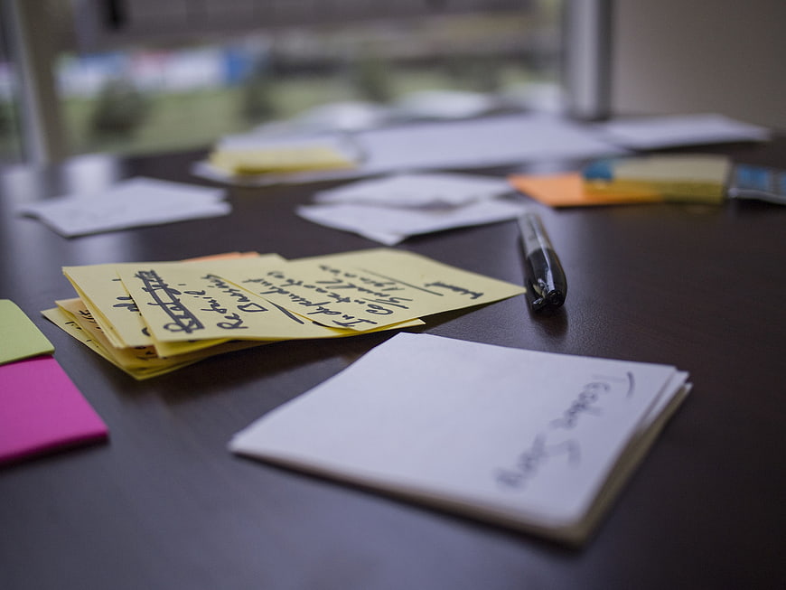 Brainstorming sticky notes and marker on office desk