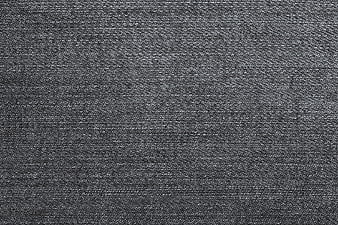 Close-up texture of dark gray denim fabric weave